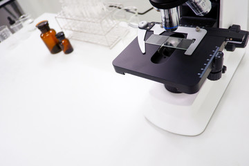 Cropped shot view of  the equipment and science experiments in Laboratory, Chemical substances for research and analyzing a sample under the microscope in laboratory.