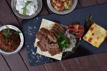 grilled Adana kebabs and vegetables