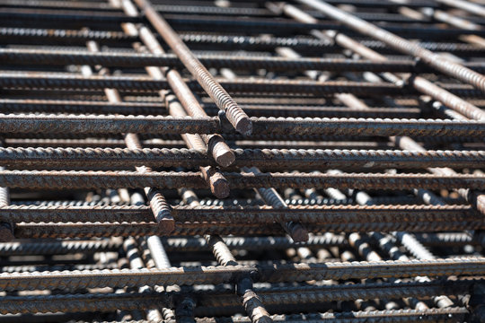 Part of the reinforced concrete structure. Rusty rebar for concrete pouring.