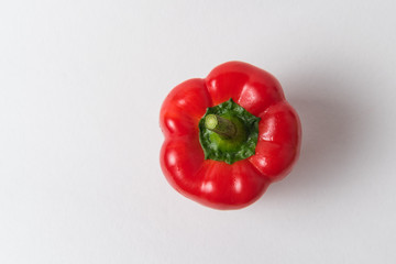 Fresh raw red pepper on white background. Top view of bell peppers