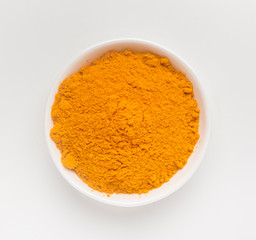 Closeup turmeric or curcumin powder in bowl