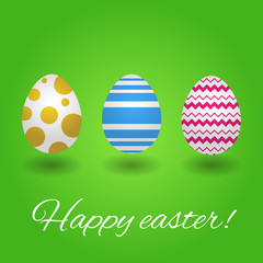 Varicoloured easter eggs on green background. Card