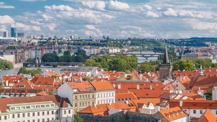 Fototapeta na wymiar Panorama of Prague Old Town with red roofs timelapse, famous bridges and Vltava river, Czech Republic.