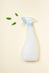 Eco-friendly cleaning spray. Organic ingredients, concept of natural cleaning products on a trendy yellow background. Zero waste concept, reuse, eco-friendly shopping, vegan