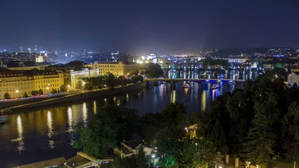 Foto op Plexiglas Scenic view of bridges on the Vltava river night timelapse and of the historical center of Prague: buildings © neiezhmakov