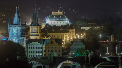 Fototapeta na wymiar Scenic view of bridges on the Vltava river night timelapse and of the historical center of Prague: buildings