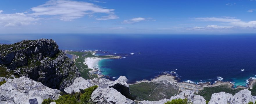 Beautiful panoramic View from Hangklip peak of the turquoise bank of Pringle Bay and the deep blue water of the Atlantic ocean
