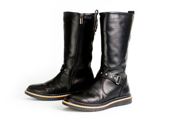 Black leather women?s boots fastened with a zipper. Background for shoes.