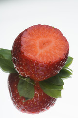 Strawberries on a white mirror background