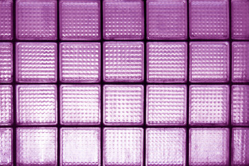 Violet surfaces dirty glass block wall for effect background.