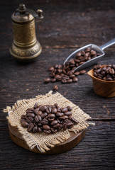 Coffee beans on wooden table.copy space.