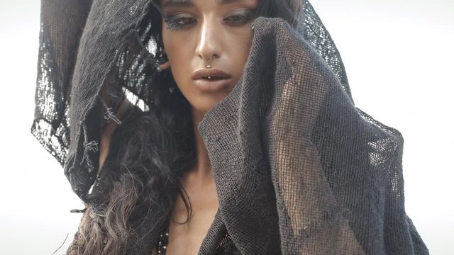 Oriental woman sensually posing in slow motion