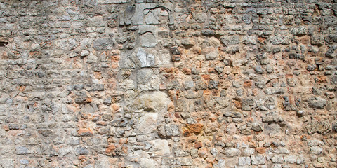Stone wall background of stones old texture ancient
