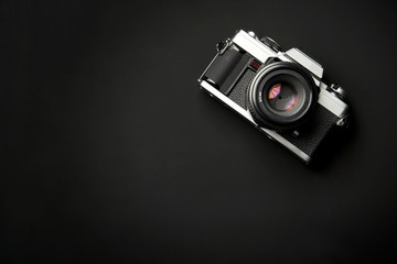 Classic analog 35 mm camera vintage on black table background