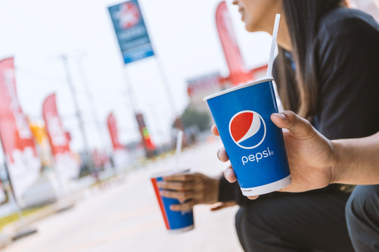 Chiang Rai, Thailand-February 25, 2020,  Pepsi soft drink in man's hand with soft-focus and over light in the background