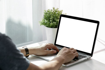 Mockup image of a man working at the laptop