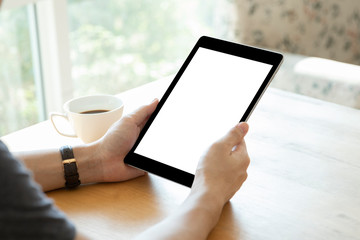 Mockup image of a man holding black color tablet device in hands