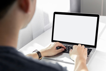 Mockup image of a man working at the laptop