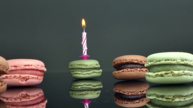 spread macaroons and a burning candle for the holiday