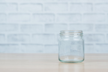 Glass jar on wooden desk.