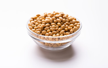 Soybeans in a glass plate on white background