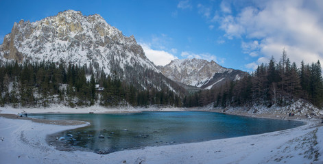 Fototapeta na wymiar Panoramic view of Green lake (Gruner see) in sunny winter day. Famous tourist destination for walking and trekking in Styria region, Austria