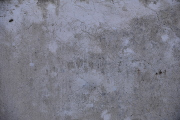 Cement wall with cracks in industrial building, surface for your design and texture background.