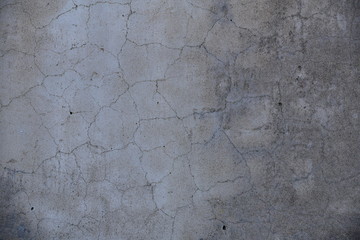 Cement wall with cracks in industrial building, surface for your design and texture background.