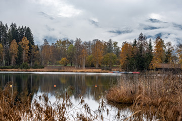 Fototapeta na wymiar Mountain alpine autumn lake Schwarzsee, Kitzbuhel, Tirol, Austria Alps.