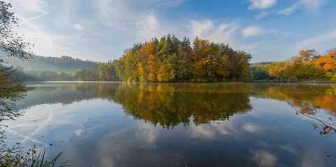 Fototapeta premium Autumn morning at lake Thal near Graz, Styria region, Austria. Panoramic view.