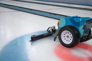 Cleaner sweeper machine on ice field
