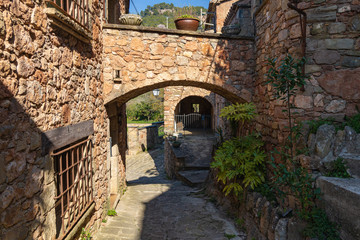 View of one of the streets of the medieval historical center with arches and tunnels, Mura. Catalonia, Spain