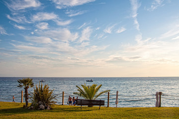 Fototapeta na wymiar Skala Fourkas, Greece - September 02, 2019: Apartment with sea view, beach and palm tree. A beautiful resort in Halkidiki, Greece.