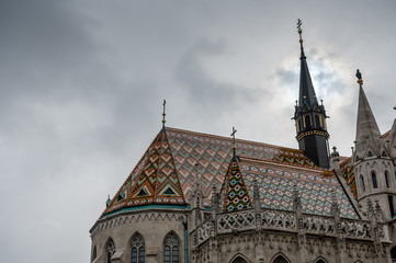 Fototapeta na wymiar Matthias Church on Buda Castle Hill a rainy winter day