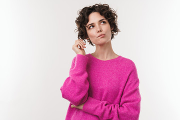 Image of serious beautiful woman thinking and looking upward
