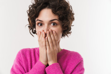 Image of surprised woman looking at camera and covering her face
