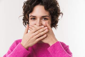 Image of joyful beautiful woman smiling and covering her mouth