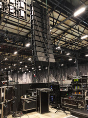 Installation of professional sound speakers, line array and stage equipment for a concert....