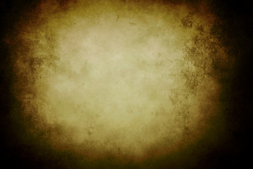 golden grungy background with black vignette borders