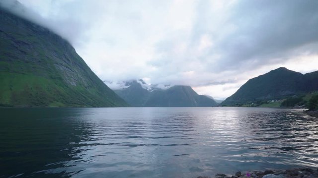 Panoramic view of norwegian fjord from the beach in Urke - cloudy gray day