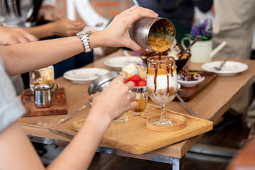A group of people are partying for drinks and fruit