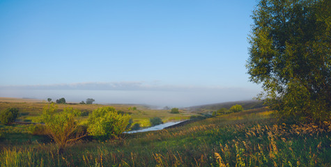 Foggy landscape with river