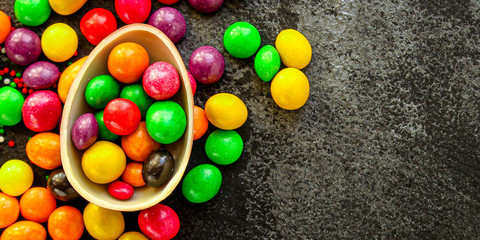 Fototapeta na wymiar chocolate egg and candy easter decor, menu concept background. top view. copy spaces