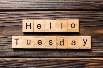 Hello Tuesday word written on wood block. Hello Tuesday text on wooden table for your desing, concept