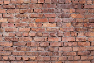 Texture of old red brick masonry. The exterior of the building.