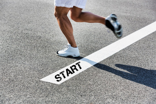 Man stepping on starting line