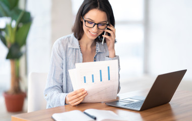 Portrait of caucasian businesswoman making phone call