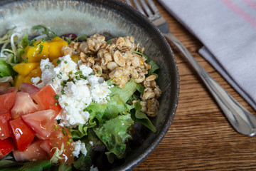 Delicious salad with goat cheese. Isolated image