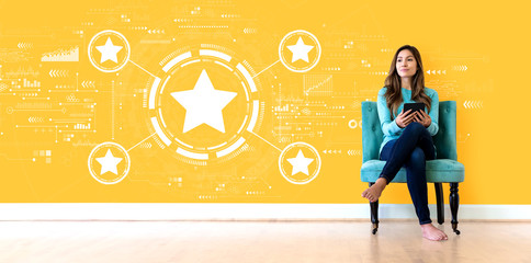 Rating star concept with young woman holding a tablet computer