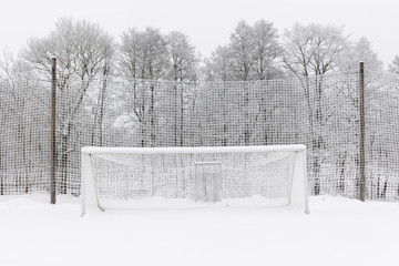 Outdoor soccer net covered in snow
